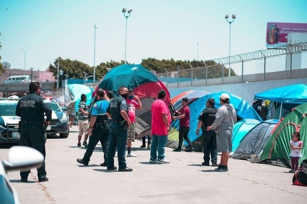 Migrants living in tents at the border.